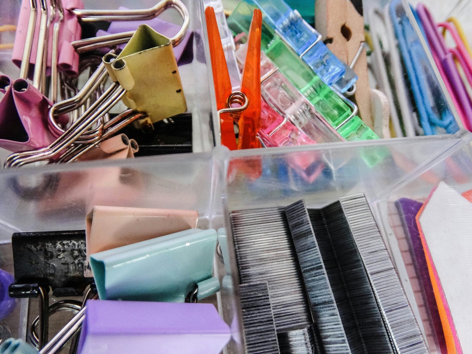 assorted color plastic container on stainless steel rack