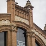 brown brick building under white sky during daytime